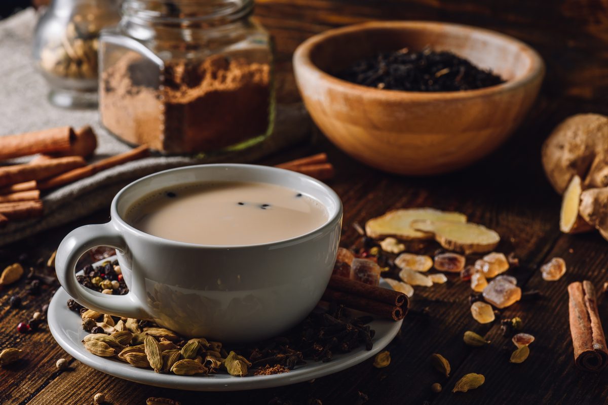 A cup of masala chai with whole spices, a popular sweetened drink